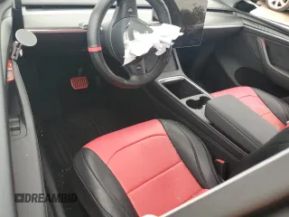 2024 Tesla Model Y z VIN 7SAYGDED4RA331714, wystawiony jako Copart lot #57043915 z przebiegiem Nie podano mil oraz Szkoda całkowita • Salvage title. Historia ofert i sprzedaży dostępna na DreamBid. Obrazek 8.