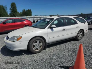 2002 Ford Taurus with VIN 1FAFP59U72A191542, listed as a Copart auction lot 64275705 with 165,421 mi miles and Salvage title. Bid and sale history available at DreamBid. Image 1.