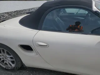 2000 Porsche Boxster z VIN WP0CA2983YU620313, wystawiony jako Copart lot #54605995 z przebiegiem 134 807 mil mil oraz Tytuł czysty. Historia ofert i sprzedaży dostępna na DreamBid. Obrazek 10.