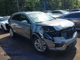 2024 Cadillac XT5 FWD Luxury z VIN 1GYKNAR47RZ730884, wystawiony jako IAAI lot #42640234 z przebiegiem 14 238 mil mil oraz . Historia ofert i sprzedaży dostępna na DreamBid. Obrazek 1.