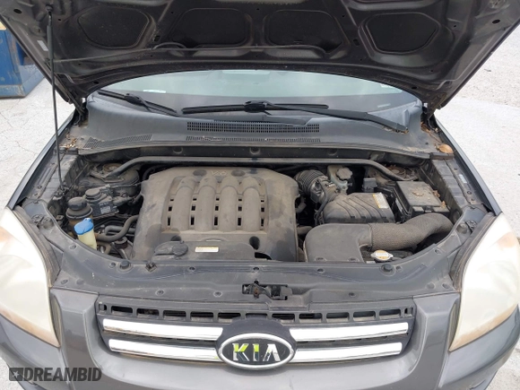 2007 Kia Sportage LX with VIN KNDJE723077397667, listed as a IAAI auction lot 42011122 with 218,744 mi miles. Bid and sale history available at carsss.com. Image 10.