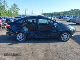 2019 Ford Fiesta SE z VIN 3FADP4BJ2KM159022, wystawiony jako IAAI lot #42269813 z przebiegiem 55 107 mil mil oraz . Historia ofert i sprzedaży dostępna na DreamBid. Obrazek 13.