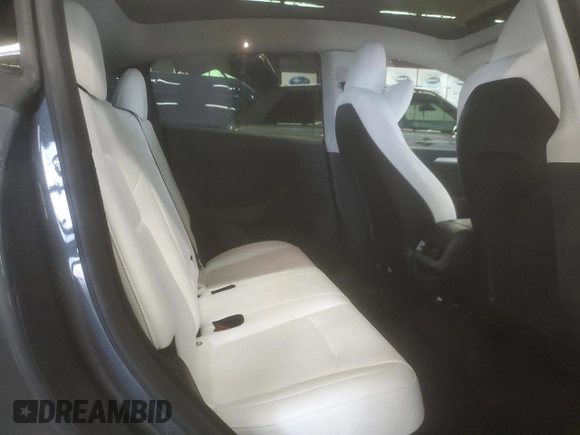2023 Tesla Model Y Long Range z VIN 7SAYGDEE6PA179733, wystawiony jako Copart lot #58399015 z przebiegiem 45 780 mil mil oraz Szkoda całkowita • Salvage title. Historia ofert i sprzedaży dostępna na DreamBid. Obrazek 11.