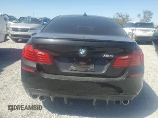 2014 BMW M5 z VIN WBSFV9C52ED593005, wystawiony jako Copart lot #49054395 z przebiegiem 71 213 mil mil oraz Szkoda całkowita • Salvage title. Historia ofert i sprzedaży dostępna na DreamBid. Obrazek 6.