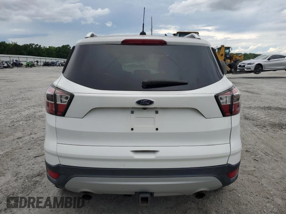 2017 Ford Escape SE z VIN 1FMCU0G99HUA75866, wystawiony jako Copart lot #57274785 z przebiegiem 132 874 mil mil oraz Czysty tytuł • Clean title. Historia ofert i sprzedaży dostępna na DreamBid. Obrazek 6.