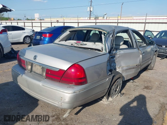 2004 Mercury Grand Marquis GS with VIN 2MEFM74W34X677247, listed as a IAAI auction lot 41856970 with 135,225 mi miles and . Bid and sale history available at DreamBid. Image 4.