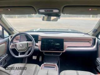 2023 Rivian R1S Launch Edition with VIN 7PDSGABL2PN003733, listed as a Copart auction lot 56033315 with 9,996 mi miles and Salvage Title. Bid and sale history available at carsss.com. Image 9.