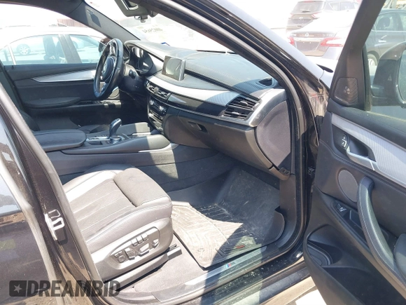 2018 BMW X6 xDrive50i with VIN 5UXKU6C58J0W39038, listed as a IAAI auction lot 40025654 with 106,080 mi miles. Bid and sale history available at carsss.com. Image 5.