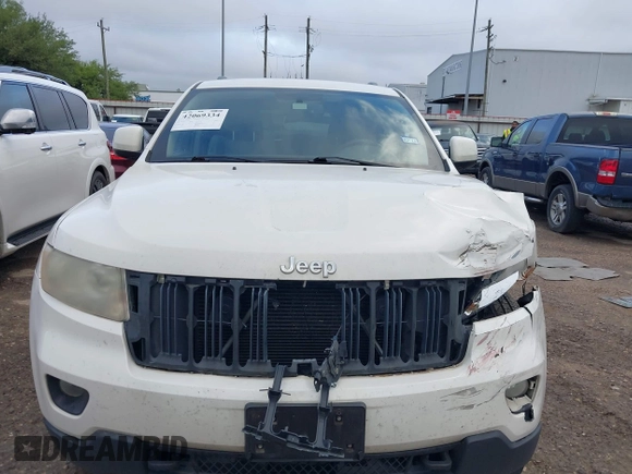 2012 Jeep Grand Cherokee Laredo with VIN 1C4RJFAG5CC224032, listed as a IAAI auction lot 42069334 with 106,614 mi miles. Bid and sale history available at carsss.com. Image 13.