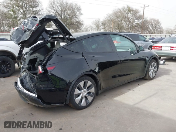 2022 Tesla Model Y Long Range z VIN 7SAYGAEE5NF428327, wystawiony jako IAAI lot #41698750 z przebiegiem 26 846 mil mil oraz . Historia ofert i sprzedaży dostępna na DreamBid. Obrazek 4.