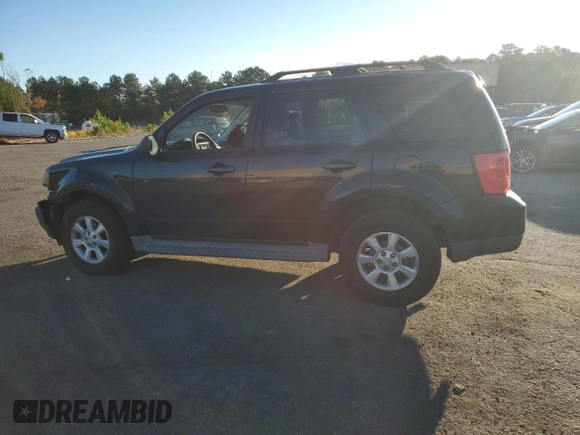 2011 Mazda Tribute Touring with VIN 4F2CY0C70BKM02624, listed as a Copart auction lot 75472464 with 172,077 mi miles and Salvage Title. Bid and sale history available at carsss.com. Image 2.