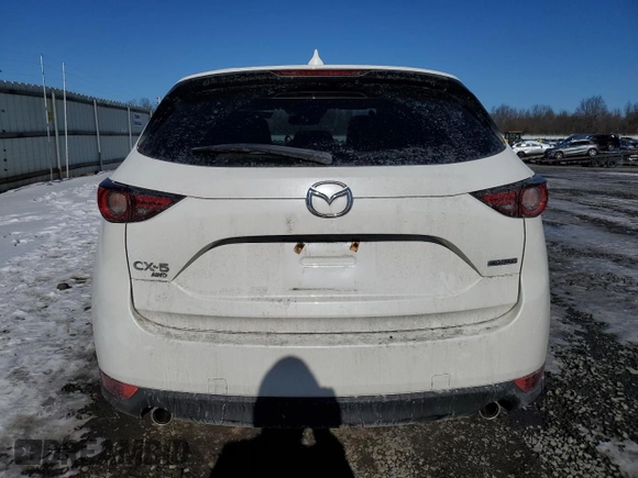 2021 Mazda CX-5 Grand Touring with VIN JM3KFBDM3M1305807, listed as a Copart auction lot 42713655 with 58,162 mi miles and Salvage Title. Bid and sale history available at DreamBid. Image 6.