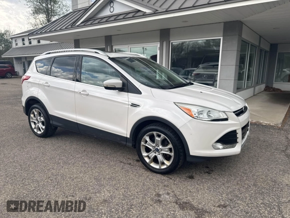 2014 Ford Escape Titanium with VIN 1FMCU9J94EUC63638, listed as a IAAI auction lot 42196241 with 198,112 mi miles and . Bid and sale history available at DreamBid. Image 1.