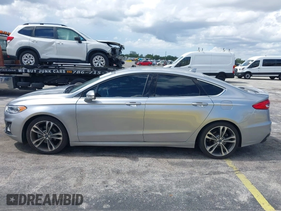 2020 Ford Fusion Titanium with VIN 3FA6P0D95LR199443, listed as a IAAI auction lot 42721371 with 77,592 mi miles and . Bid and sale history available at DreamBid. Image 14.
