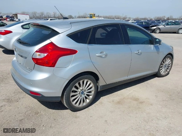 2012 Ford Focus Titanium with VIN 1FAHP3N20CL402944, listed as a IAAI auction lot 41784935 with NaN miles. Bid and sale history available at carsss.com. Image 4.