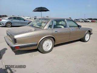 1994 Jaguar XJ с VIN SAJKX174XRC692378, выставлен на аукционе Copart как лот 65275795 с пробегом 80 748 миль миль и Чистый • Clean title. История ставок и продаж доступна на DreamBid. Изображение 3.