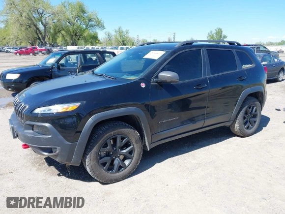 2018 Jeep Cherokee Trailhawk Leather Plus with VIN 1C4PJMBXXJD572667, listed as a IAAI auction lot 42216477 with 85,890 mi miles and . Bid and sale history available at DreamBid. Image 2.