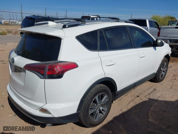2017 Toyota RAV4 XLE with VIN JTMRFREV5HJ123412, listed as a IAAI auction lot 42018549 with 127,974 mi miles. Bid and sale history available at carsss.com. Image 4.