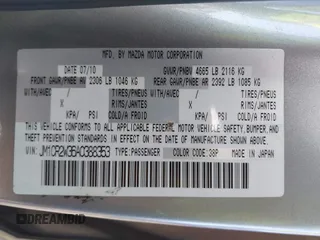 2010 Mazda 5 Sport with VIN JM1CR2W36A0388353, listed as a IAAI auction lot 42121004 with 169,658 mi miles. Bid and sale history available at carsss.com. Image 9.