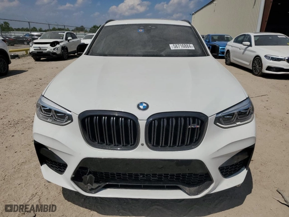 2020 BMW X4 M with VIN 5YMUJ0C03LLA99775, listed as a Copart auction lot 58716884 with 60544 miles and Salvage Title. Bid and sale history available at carsss.com. Image 5.