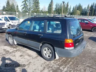 1999 Subaru Forester L with VIN JF1SF6351XH716957, listed as a IAAI auction lot 41969521 with 253,696 mi miles. Bid and sale history available at carsss.com. Image 3.