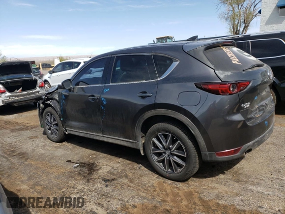 2018 Mazda CX-5 Grand Touring z VIN JM3KFBDM4J0300519, wystawiony jako Copart lot #51548745 z przebiegiem 102 853 mil mil oraz Szkoda całkowita • Salvage title. Historia ofert i sprzedaży dostępna na DreamBid. Obrazek 2.