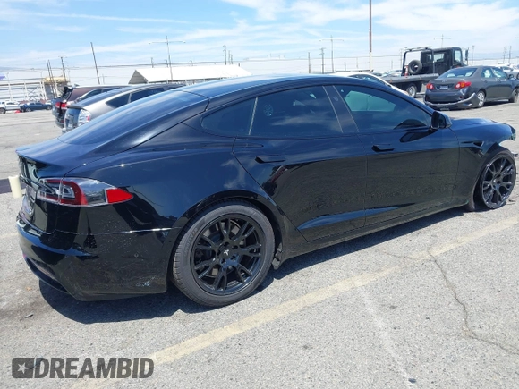 2022 Tesla Model S with VIN 5YJSA1E51NF464231, listed as a IAAI auction lot 42077838 with 53,290 mi miles and . Bid and sale history available at DreamBid. Image 4.