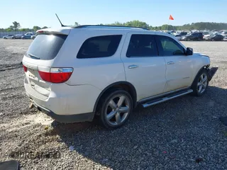 2013 Dodge Durango Citadel with VIN 1C4SDHET0DC571961, listed as a IAAI auction lot 42050261 with 257,637 mi miles and . Bid and sale history available at DreamBid. Image 4.