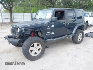 2007 Jeep Wrangler Unlimited Sahara z VIN 1J8GA59187L104774, wystawiony jako IAAI lot #42485359 z przebiegiem 192 254 mil mil oraz . Historia ofert i sprzedaży dostępna na DreamBid. Obrazek 18.