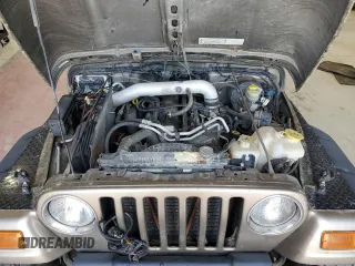 2003 Jeep Wrangler Sport z VIN 1J4FA49S23P303662, wystawiony jako Copart lot #60335135 z przebiegiem 158 490 mil mil oraz Czysty tytuł • Clean title. Historia ofert i sprzedaży dostępna na DreamBid. Obrazek 12.