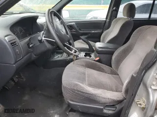 2001 Jeep Grand Cherokee Laredo with VIN 1J4GW48SX1C607432, listed as a Copart auction lot 51649365 with 296,308 mi miles and Salvage Title. Bid and sale history available at carsss.com. Image 7.