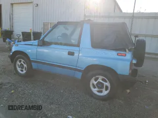 1995 Geo Tracker z VIN 2CNBE18U4S6948656, wystawiony jako Copart lot #76087194 z przebiegiem 163 080 mil mil oraz Szkody całkowita. Historia ofert i sprzedaży dostępna na DreamBid. Obrazek 2.