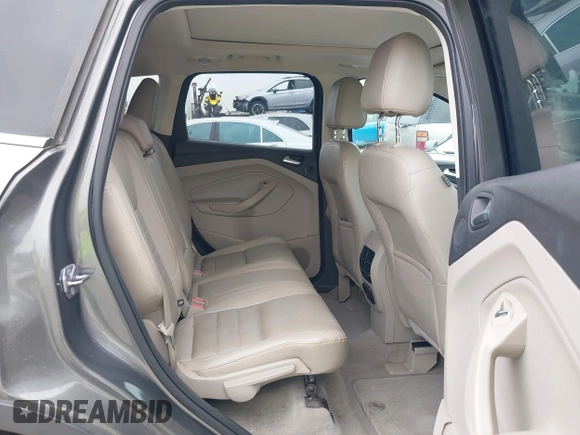 2014 Ford Escape SE with VIN 1FMCU9GX7EUC04296, listed as a IAAI auction lot 42159486 with 108,598 mi miles and . Bid and sale history available at DreamBid. Image 8.