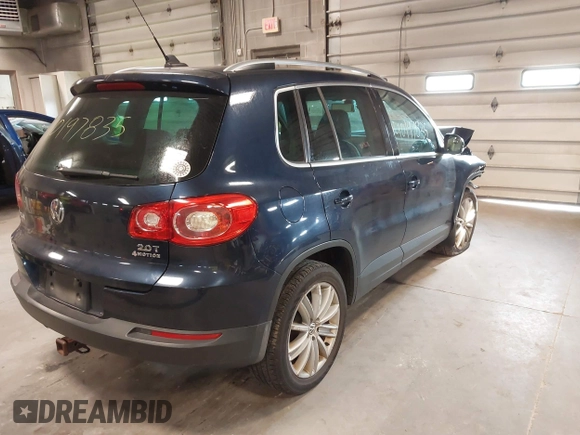 2011 Volkswagen Tiguan SE with VIN WVGBV7AXXBW533872, listed as a IAAI auction lot 40197835 with 104,685 mi miles and . Bid and sale history available at DreamBid. Image 4.