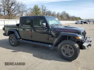 2020 Jeep Gladiator Rubicon with VIN 1C6JJTBG3LL112251, listed as a Copart auction lot 54123125 with Not provided miles and Salvage title. Bid and sale history available at DreamBid. Image 4.