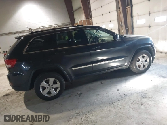 2013 Jeep Grand Cherokee Laredo with VIN 1C4RJFAG9DC583269, listed as a IAAI auction lot 41241085 with 147,995 mi miles. Bid and sale history available at carsss.com. Image 4.