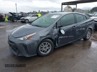 2021 Toyota Prius L Eco with VIN JTDKAMFUXM3143646, listed as a IAAI auction lot 41507110 with 207,238 mi miles. Bid and sale history available at carsss.com. Image 2.