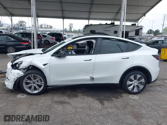 2022 Tesla Model Y Long Range with VIN 7SAYGDEE3NF518061, listed as a IAAI auction lot 41896233 with 34,714 mi miles and . Bid and sale history available at carsss.com. Image 14.