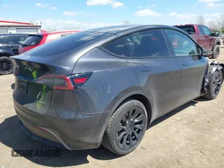 2024 Tesla Model Y Long Range with VIN 7SAYGAEE4RF078906, listed as a IAAI auction lot 42051207 with Not Provided miles and . Bid and sale history available at DreamBid. Image 4.