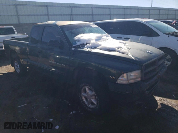 1999 Dodge Dakota SLT with VIN 1B7GG22X0XS239398, listed as a Copart auction lot 80143414 with 147,646 mi miles and Salvage Title. Bid and sale history available at DreamBid. Image 4.