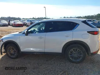 2019 Mazda CX-5 Sport with VIN JM3KFBBM0K0574255, listed as a IAAI auction lot 41661924 with 93,851 mi miles and . Bid and sale history available at DreamBid. Image 14.