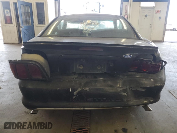 1997 Ford Mustang with VIN 1FALP4047VF158249, listed as a Copart auction lot 55669455 with 175,458 mi miles and Salvage title. Bid and sale history available at DreamBid. Image 6.