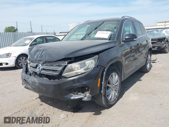 2012 Volkswagen Tiguan SE with VIN WVGAV7AX6CW521960, listed as a IAAI auction lot 42249355 with 118,496 mi miles and . Bid and sale history available at DreamBid. Image 2.