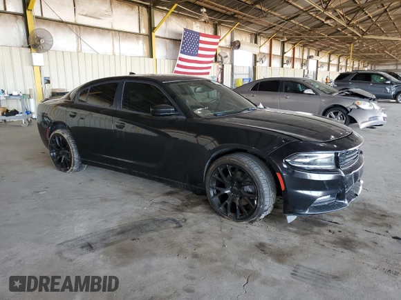 2015 Dodge Charger SXT with VIN 2C3CDXJG9FH748809, listed as a Copart auction lot 61682335 with 128,252 mi miles and Salvage title. Bid and sale history available at DreamBid. Image 4.
