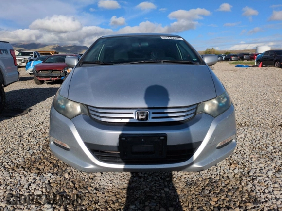 2010 Honda Insight LX with VIN JHMZE2H51AS011243, listed as a Copart auction lot 54445555 with 224,722 mi miles and Salvage Title. Bid and sale history available at DreamBid. Image 5.