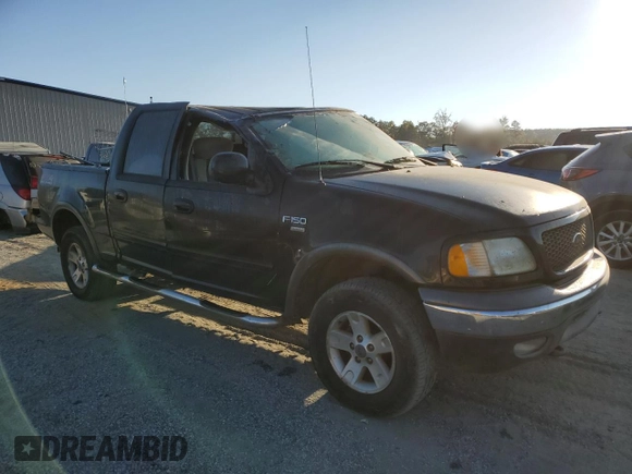 2003 Ford F-150 XLT with VIN 1FTRW08623KD45425, listed as a Copart auction lot 77605404 with 174,369 mi miles and Salvage Title. Bid and sale history available at carsss.com. Image 4.