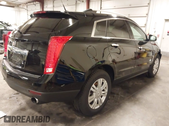 2011 Cadillac SRX Luxury Collection with VIN 3GYFNDEY3BS675672, listed as a IAAI auction lot 41804978 with 148,136 mi miles. Bid and sale history available at carsss.com. Image 4.
