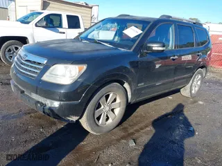 2009 Kia Borrego EX with VIN KNDJJ742X95034968, listed as a IAAI auction lot 41411206 with 146,584 mi miles. Bid and sale history available at carsss.com. Image 2.