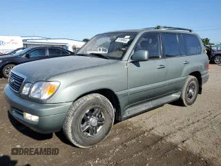 2002 Lexus LX 470 z VIN JTJHT00W723519186, wystawiony jako Copart lot #70190464 z przebiegiem 306 793 mil mil oraz Tytuł czysty. Historia ofert i sprzedaży dostępna na DreamBid. Obrazek 1.