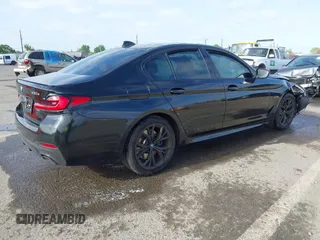 2023 BMW 5 Series 530e with VIN WBA13AG09PCL56556, listed as a IAAI auction lot 42098427 with Not provided miles and . Bid and sale history available at DreamBid. Image 4.